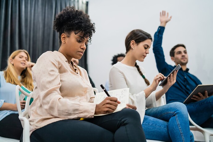group-young-people-sitting-conference-together-while-raising-their-hands-ask-question-business-team-meeting-seminar-training-concept