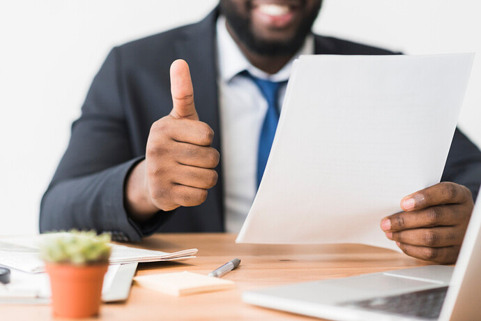 ethnic-employee-gesturing-thumb-up
