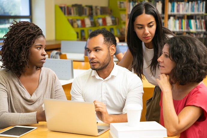 excited-colleagues-discussing-some-questions-library (1)